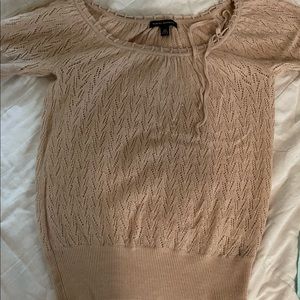 Short sleeve, tan, lightweight sweater with ribbon trim.